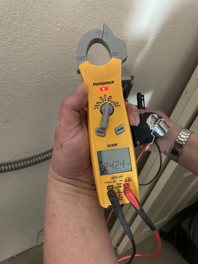 Voltage testing with clamp meter during Whole House Surge Protector in Jefferson